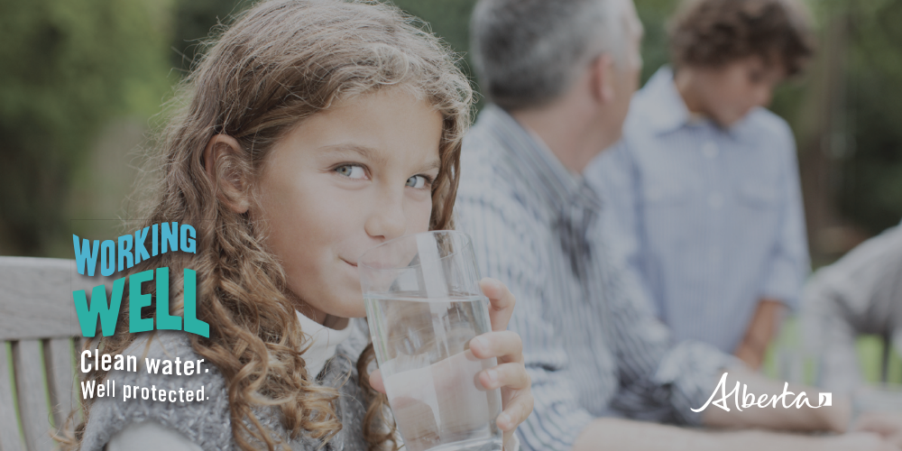 Young girl drinking fresh water